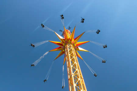 Kouvola, Finland - 18 May 2019: Ride Star Flyer in motion on sky background in amusement park Tykkimakiのeditorial素材