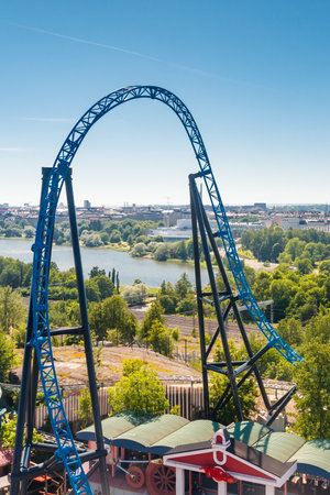 Helsinki, Finland - 24 June 2022: Top view of Linnanmaki amusement park with roller coaster Taiga and Helsinki city.のeditorial素材