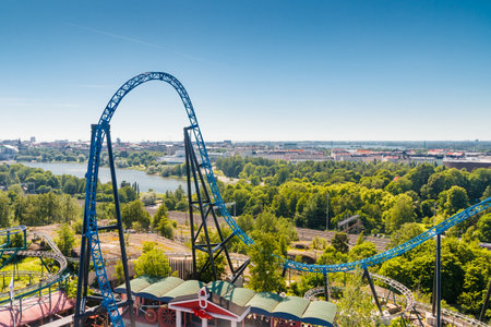 Helsinki, Finland - 24 June 2022: Top view of Linnanmaki amusement park with roller coaster Taiga and Helsinki city.のeditorial素材