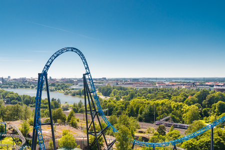 Helsinki, Finland - 24 June 2022: Top view of Linnanmaki amusement park with roller coaster Taiga and Helsinki city.のeditorial素材