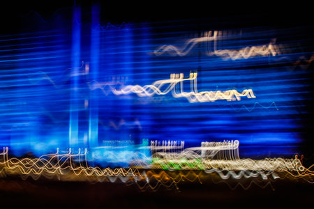 Abstract blurred colorful light effect on a black background. Long exposure photo of moving camera.