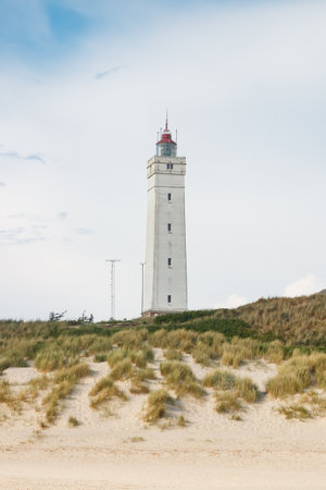 Lighthouse in the sand dunes on the beach of Blavand, Jutland Denmark Europeの写真素材