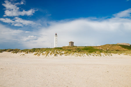 Lighthouse and bunker in the sand dunes on the beach of Blavand, Jutland Denmark Europeの写真素材