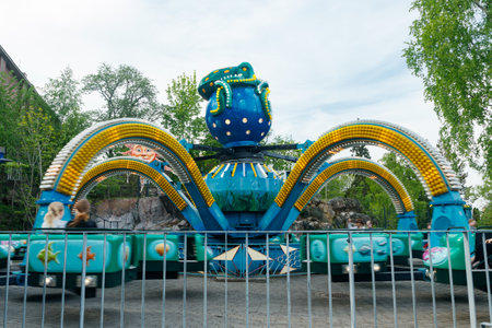 Helsinki, Finland - May 21, 2023: Carousel Mustekala in motion in Linnanmaki amusement parkのeditorial素材