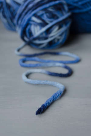 Woolen melange yarn on a gray background