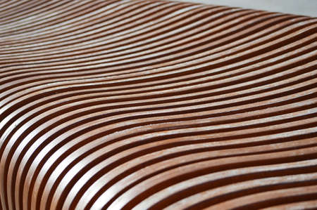 Texture of curved lacquered wooden planks. abstract background.