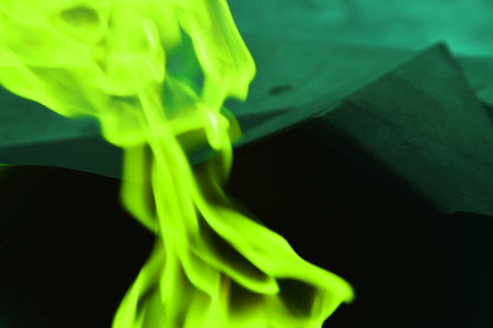 Green neon abstract smoke, flames on a dark background.
