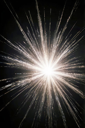 Bright rays of bright white light diverge from the center on a black background. Transparent shining star, bright flash.の素材