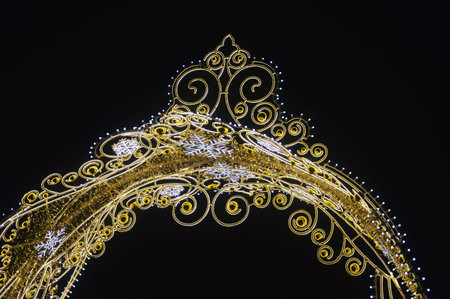 Decorative street Christmas illuminations with golden lights. A fragment of the city's festive decorations. Russia. Moscow.の写真素材