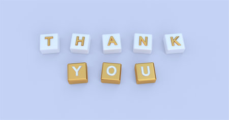 Thank you word is written on plastic blocks on blue backgroundの写真素材