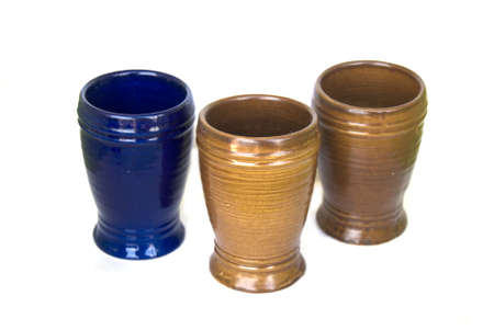 Ceramic glasses blue and brown on white backgroundの写真素材