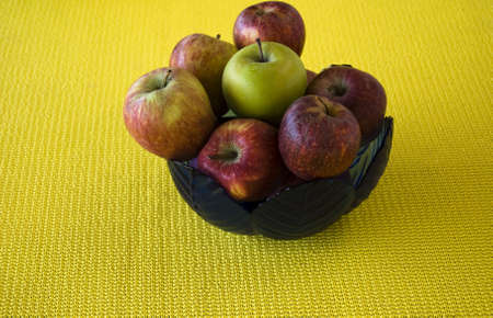 Group of  the fruits in a vase on yellow の写真素材
