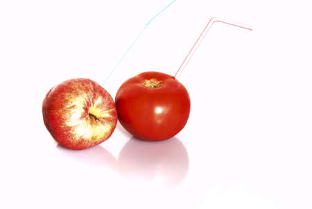 Tomate and apple isolated on the white backgroundの写真素材