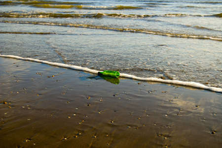 The Bottle on the beach of Atlantic oceanの写真素材