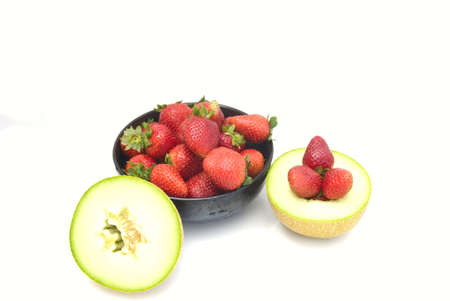 The strawberry and melon isolated on a white backgroundの写真素材
