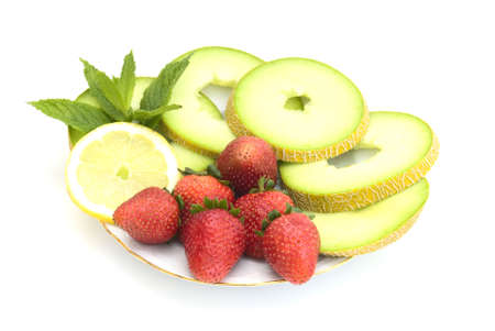 The strawberry and melon isolated on a white backgroundの写真素材