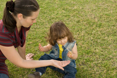 Mother with daughter rest in the parkの写真素材