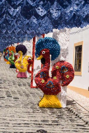 REDONDO, PORTUGAL -10 AUGUST 2013. Festival flower  in streets in Alentejo- Ruas floridas-Made paper´s dolls on 10 August 2013 Redondo, Portugalのeditorial素材