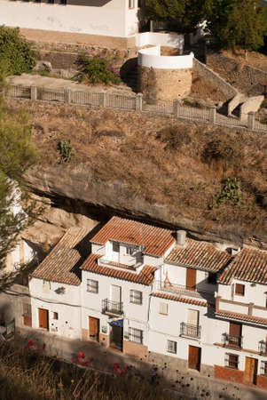 Setenil de las Bodegas is one of the pueblos blancos  white villages  of Andalucia, Spain, famous for its dwellings built into rock overhangs above the Rio Trejoの写真素材