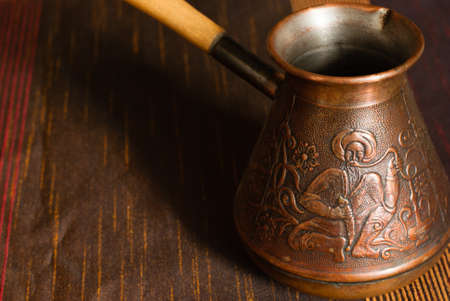 Turkish coffe pot with cup of coffeの写真素材