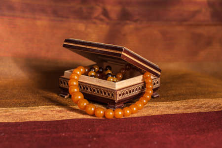 Amber necklace in brown wood  boxの写真素材