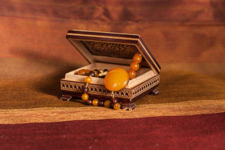 Amber necklace in brown wood  boxの写真素材
