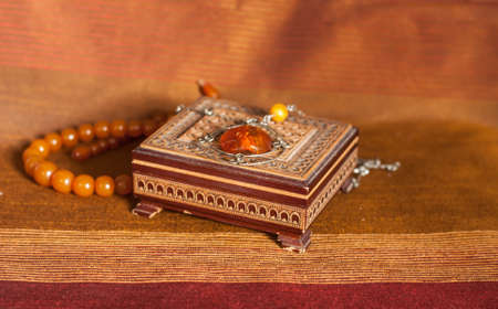 Amber necklace in brown wood  boxの写真素材