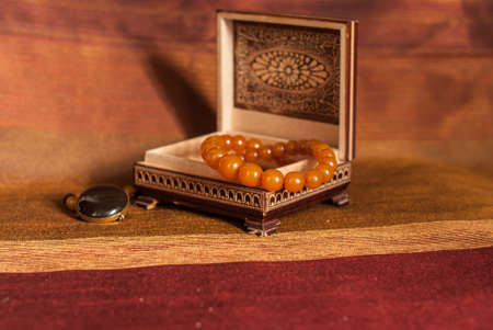 Amber necklace in brown wood  boxの写真素材