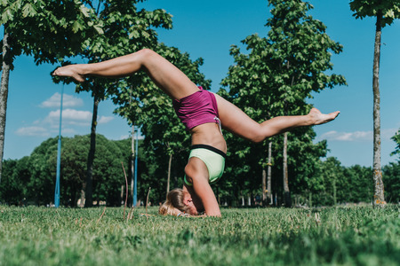 Split on elbows in the park on a grass in a sunny dayの写真素材