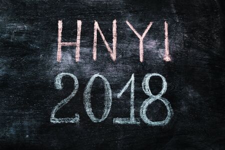 Happy 2018 new year card template with white chalk greetings on blackboard.の写真素材