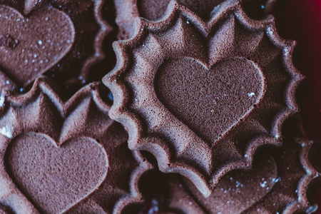 Chocolate cupcakes in the form of hearts - fresh pastries, the concept of declaration of love