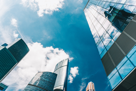 Skyscraper of Business Center. Clouds are reflected in modern glass building exteriorの写真素材