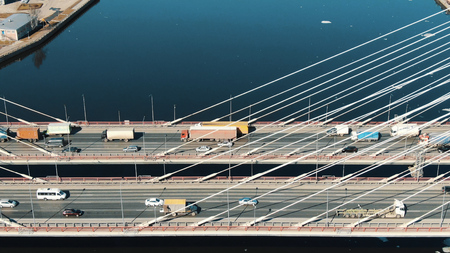 Aerial view, car traffic moves on cable-stayed bridgeの写真素材