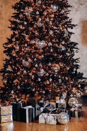 Christmas tree decorated with ornaments and garlandsの写真素材