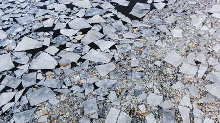 Big floes floating on cold water surface of sea in winterの写真素材