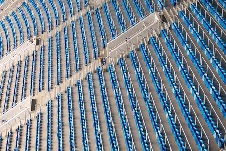 Empty blue and white stadium seats in geometric pattern
