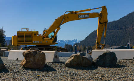 A John Deer heavy duty construction excavator ready for work in the park of the Hot Springs...