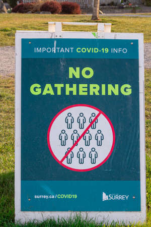 Coronavirus pandemic, No gathering public sign in local park, Please adhere to social distancing, no...