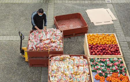 Fresh Fruit Market. Top view of the street market in the morning with people, healthy colorful vegetables and fruits. New Westminster BC, Canada-December 5,2021. Top view, street photoのeditorial素材