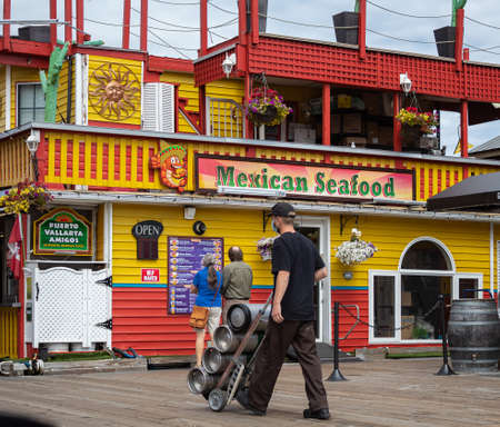 Floating Home Village Houseboats and Restaurants in Fisherman's Wharf Inner Harbor, Victoria BC, Canada. Mexican Seafood floating restaurant. Street photo, travel photo-July 23,2021のeditorial素材