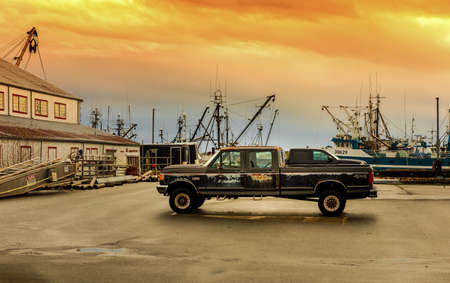 Fishing boat harbor at Richmond BC, Canada. Truck parked at the seaport in overcast day-December 22, 2021. Street photo, selective focus, nobodyのeditorial素材