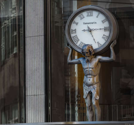 Vancouver BC, Canada. September 29,2020. Atlas man fugure holding clock above Tiffany Store and Co. in downtown in Vancouver. Selective focus, close up.のeditorial素材