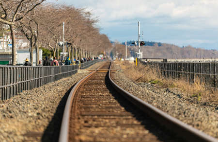 Railroad in motion at sunset. Railway station, industrial concept background. Railroad travel, railway tourism. Blurred railway. transportation. Travel photo, blurredの写真素材