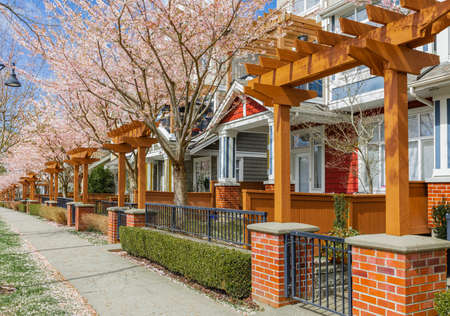 Neighborhood modern houses with spring flowers in BC, Canada. Canadian modern residential...