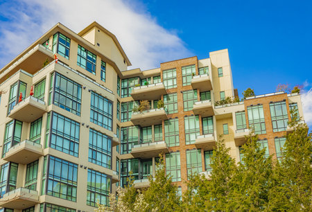 Neighborhood modern houses on sunny day in New Westminster BC, Canada-April 5,2022. Canadian modern...