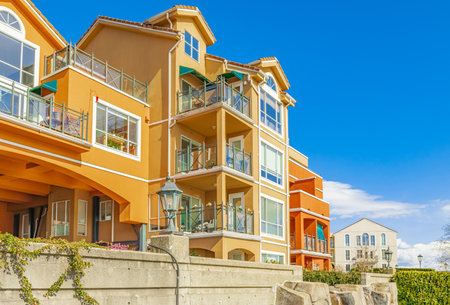 Neighborhood modern houses on sunny day in New Westminster BC, Canada-April 5,2022. Canadian modern residential architecture. Nobody, street photoのeditorial素材