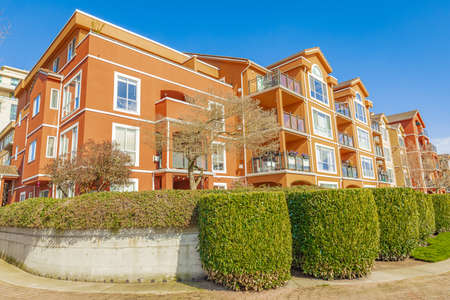 Neighborhood modern houses on sunny day in New Westminster BC, Canada-April 5,2022. Canadian modern residential architecture. Nobody, street photoのeditorial素材