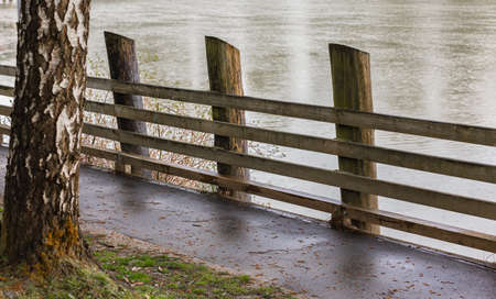 Path with wooden fence, walkway in the park by a river. Trail path in the park in Canada. Travel photo, selective focus, nobodyの写真素材