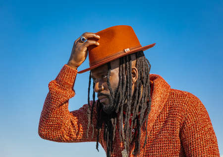 Handsome attractive young african american man guy with dreadlocks and hat outdoor. street photo. White Rock BC, Canada-March 3,2022のeditorial素材