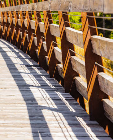 Pedestrian Wooden Bridge in Autumn Park in BC Canada. Street view, travel photo, abstract, nobody